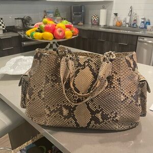 Exquisite Nancy Gonzalez. Authentic python bag